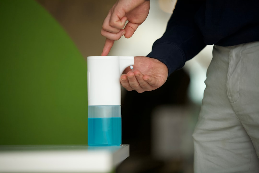 person-in-black-long-sleeve-shirt-holding-white-and-blue-plastic-cup-fajnwbfrbdu