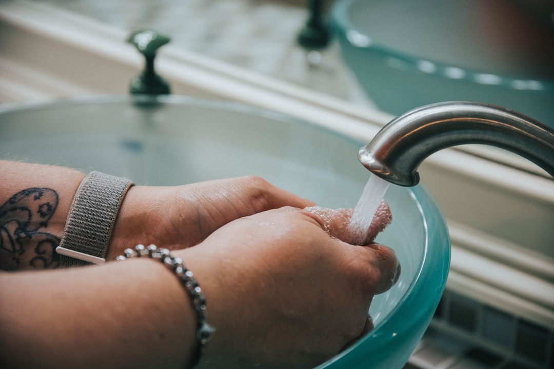 washing hand in a raised sink